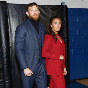 Tony McGregor and Margaret McGregor in a promotional photo shoot for 'Conor McGregor: Notorious'. Dark studio backdrop.