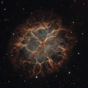 High-resolution image of the Crab Nebula, a supernova remnant with vibrant hues of red and blue, showcasing intricate shapes and patterns.