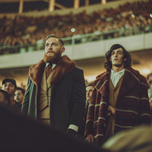 Conor McGregor and Charles Oliveira in a high-definition photograph. They stand out in a sea of fans at a packed stadium during a UFC event.