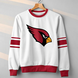 Arizona Cardinals crewneck sweatshirt, featuring the team's iconic bird mascot logo. The soft fabric and classic design make it a favorite among football fans. Casual attire, white and red color scheme, photo.