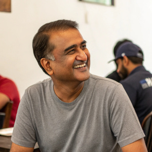 Praful Patel, Indian politician, in a casual meetup. Wearing grey t-shirt, smiling