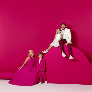 Tori Spelling, Stella Doreen McDermott, Liam Aaron McDermott, and Dean McDermott at the Kids' Choice Awards. Formal wear, colorful backdrop.