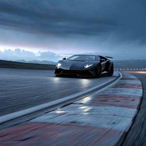 High-performance Lamborghini Aventador SVJ, midnight blue with black accents, racing on a winding track.