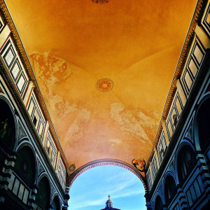 Stunning interior shot of Florence Cathedral, known as Il Duomo. The intricate ceiling details are highlighted in a vibrant photograph.