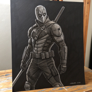 A charcoal drawing of Slade Wilson aka Deathstroke. The vigilante stands in an intense stance, his form defined by sharp lines and detailed muscle structure. The drawing captures the severity of his angular face and unwavering gaze. Set against a simple black backdrop.