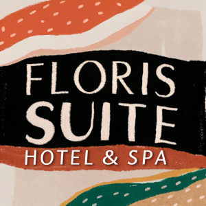 A logo for the Floris Suite Hotel & Spa. Vibrant colors representing Curacao's cultural diversity. Modern, bold sans-serif font.
