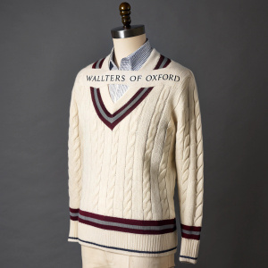 Introducing the 100% wool cricket sweater from Walters of Oxford. A perfect blend of comfort and style. Featured in a crisp, professional image on a mannequin, showcasing its classic design. Wrapped in a neutral color palette, complemented by the subtle Walters of Oxford logo.