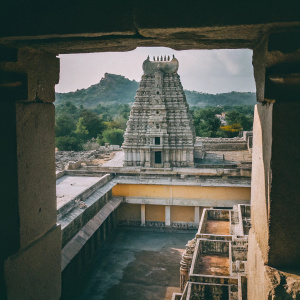 Aerial view of Virupaksha Temple in Hampi, Karnataka. Intricate carvings and multiple levels.