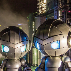 Detailed 3D models of two spherical characters, reminiscent of 'Megaman Zero' series. Dark, futuristic environment.