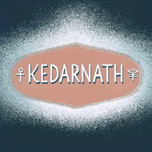 A vibrant logo featuring the name 'Kedarnath' in both English and local script. The logo is centered with modern typography contrasting ancient symbols. Rich terracotta background.