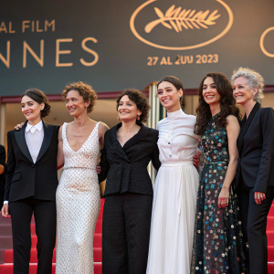 Group of actors at the Cannes Film Festival. Golshifteh Farahani, Muriel Robin, Anais Demoustier, Aelys Le Neve, Caroline Grant, Celeste Carrale, Justine Morin, and Tristan Farge posing together