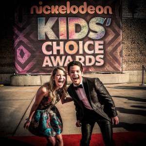 Nathan Kress and London Elise Kress attending the Nickelodeon Kids' Choice Awards, on the red carpet. Formal attire, colorful backdrop with Nickelodeon logos.