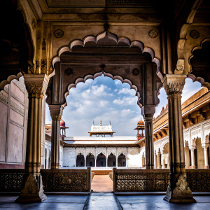 Photograph of Diwan-i-Am, Red Fort, Agra. Intricate interior design, detailed architecture, arches, and columns.
