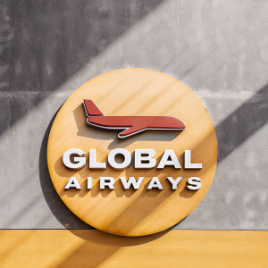 New airline logo featuring sleek red jet aircraft graphic and bold white text 'Global Airways' on navy blue backdrop.