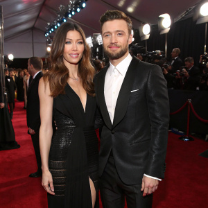 Justin Timberlake and Jessica Biel at the Grammy Awards. Both are in elegant black attire.