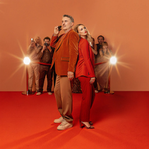 Anthony LaPaglia and Alexandra Henkel attending the premiere of 'Florida Man'. Crowded red carpet event, paparazzi flashes in the background.