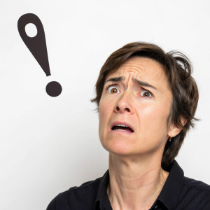 Concerned expression with an exclamation mark.