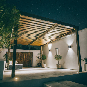 Luxurious outdoor patio under starry night. Modern wooden pergola with recessed lighting. Potted plants and wall-mounted fixtures. High-end residential area. Photo