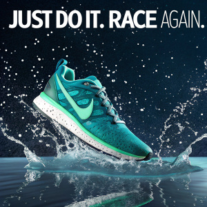 Digital ad for Nike's latest shoe. Teal and green athletic shoe surrounded by water splashes. Dark starry background. Text reads 'Just Do It. Race Again.'