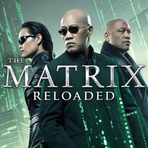Blu-ray cover of The Matrix Reloaded. Futuristic cityscape background with green lines and characters from the film in combat attire. Promotional text highlights special edition features.