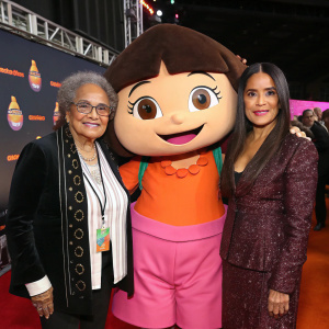 Marian Wright Edelman and Salma Hayek flank the Dora the Explorer mascot. They pose for a formal group photo at the Nickelodeon Kids' Choice Awards.