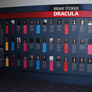 Interactive infographic detailing the evolution of Dracula from Bram Stoker's novel to various cinematic adaptations. The timeline spans decades, highlighting films with vibrant colors such as brown, gray, pink, and blue.