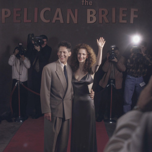 Lyle Lovett and Julia Roberts attending the Hollywood premiere of 'The Pelican Brief'. Surrounded by flashing cameras and excited fans on the red carpet.