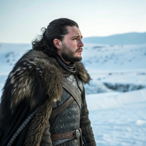 Close-up portrait of Jon Snow, Game of Thrones character, standing alone in snowy landscape.