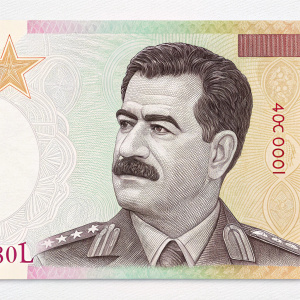 Saddam Hussein's image on a new currency design. The bill features a portrait with detailed facial features against a gradient background of various shades.