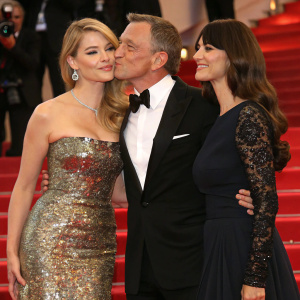Daniel Craig, Lea Seydoux, and Monica Bellucci at Cannes Film Festival. Formal attire, cheek kiss greeting.