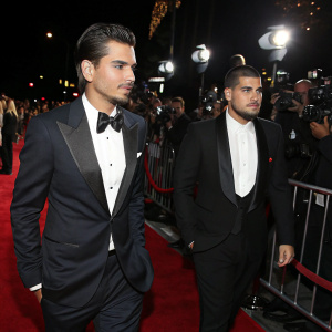 Scott Disick and Rob Kardashian at a Hollywood premiere. Elegant attire, red carpet ambiance, flashing cameras.