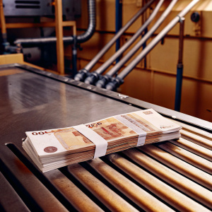 Russian banknotes collection on a metal surface. Various denominations, including 5000 rubles. Industrial setting.