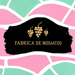 Fabríca de Mosaicos logo featuring golden grape motifs. The design is sleek and sophisticated. The brand name and category are written in classic serif font. Rich colors like gold and deep brown create a warm, luxurious feel.
