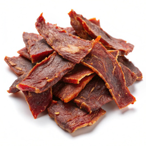 beef jerky thin slices scattered on a white background
