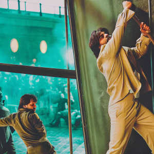 Bollywood stars, including Shah Rukh Khan, in an action-packed scene from the highly anticipated 2022 film Pathaan. Vibrant colors and intense atmosphere