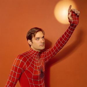 Tobey Maguire as Spider-Man, standing alone in a stark white room. No background, spotlight