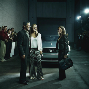 Antonio Banderas, Nicole Kimpel, and Sandra Garcia-Sanjuan at the Ford Mustang Launch Event. Formal attire, smiling for photographers.