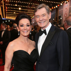 Ruthie Henshall and Anthony Andrews at a glamorous awards ceremony. Ruthie is in a black gown, both are beaming.
