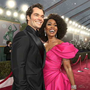 Henry Cavill and Angela Bassett at an awards show. Henry is in a sleek black suit and Angela in a vibrant pink gown. Both with big smiles, waving for the cameras.