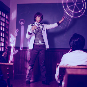 Makoto Naegi from Danganronpa, standing in a futuristic classroom. The background is filled with neon lights and holographic projections.