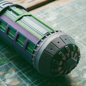 A highly detailed 3D render of Neo Cortex's pod from Crash Bandicoot 4. The pod features a mix of green, purple, and gray elements. It showcases an intricate design with numerous components and parts.