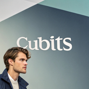 Logo design for Cubitts. Modern, sans-serif font. Gradient background from light gray to white.