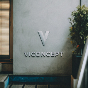 Modern logo design for Viconcept. A sleek and minimalistic logo with a stylized letter 'V'. The brand name appears beneath in a clear font. Set against a vibrant blue backdrop, the logo stands out in crisp white.