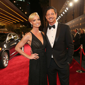 Jaime Pressly and Simon Rex at the GQ Men of the Year Awards. Luxurious backdrop with red carpet.