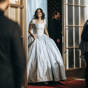 Marion Cotillard glams up in a stunning white ball gown, at the Critics' Choice Movie Awards gala. Rich blue backdrop, sparkling with stars