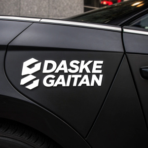 A sleek, modern logo design featuring DASKE GAITAN in bold, sans-serif font. The white text stands out against a solid black backdrop.
