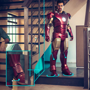 Blueprint detailing Iron Man's suit. Chest plate, shoulder armor, leg armor, and footwear highlighted. Detailed design showcasing metallic and angular features.