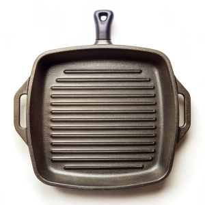 Empty cast iron grill pan with handle top view on white background