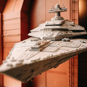 Digital art of a Star Wars Imperial Star Destroyer. Gray color, intricate details, against a black backdrop.