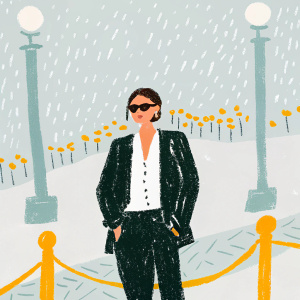 Italian actress Monica Bellucci at an exclusive event. She sports a black blazer and white shirt, paired with black pants. Dressed in stylish sunglasses and standing confidently. The background showcases a bustling street scene at night, illuminated by street lamps and adorned with a crowd barrier.